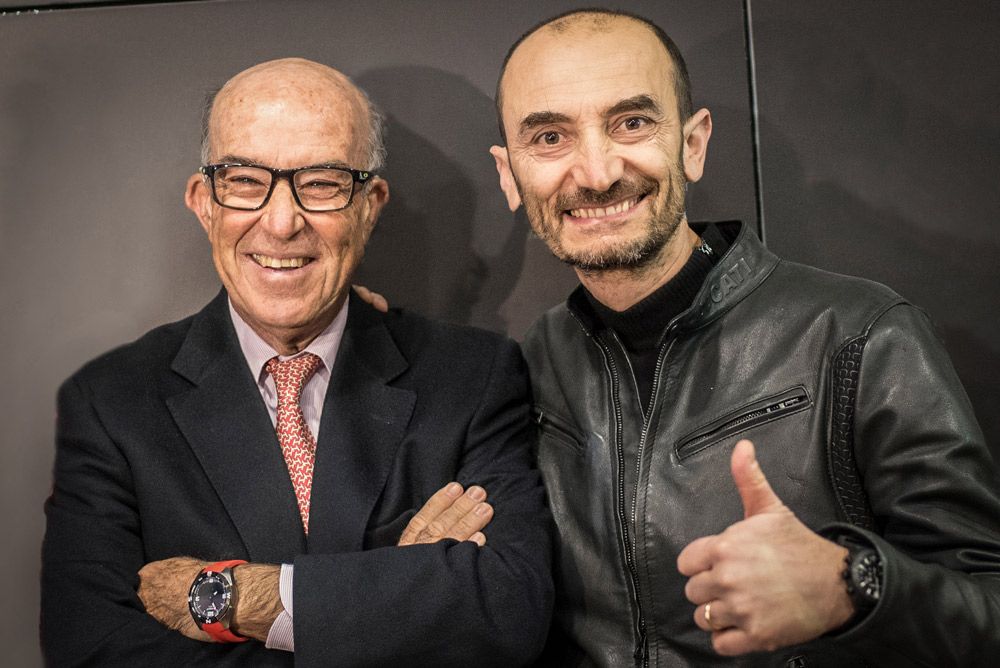 Claudio Domenicali and Carmelo Ezpeleta shake hands during the agreement for Ducati to be the official supplier for Dorna Sports MotoE category