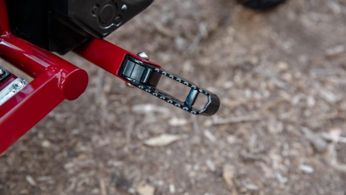 A close-up of the unfordable foot peg on the new sFTR Mini motorcycle from Indian Motorcycles - an electric-youth bike available to the smaller riding community