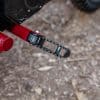 A close-up of the unfordable foot peg on the new sFTR Mini motorcycle from Indian Motorcycles - an electric-youth bike available to the smaller riding community