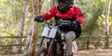 a young rider trying out the new sFTR Mini motorcycle from Indian Motorcycles - an electric-youth bike available to the smaller riding community