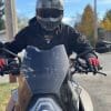 Rider with REV'IT Sand 4 Gloves in black and red with Scorpion Covert X helmet on 2016 KTM Super Duke GT