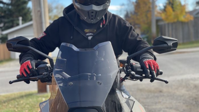 Rider with REV'IT Sand 4 Gloves in black and red with Scorpion Covert X helmet on 2016 KTM Super Duke GT Rider with REV'IT Sand 4 Gloves in black and red with Scorpion Covert X helmet on 2016 KTM Super Duke GT