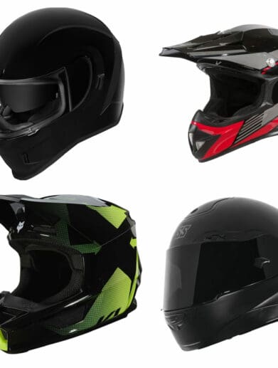 Four motorcycle helmets on white background
