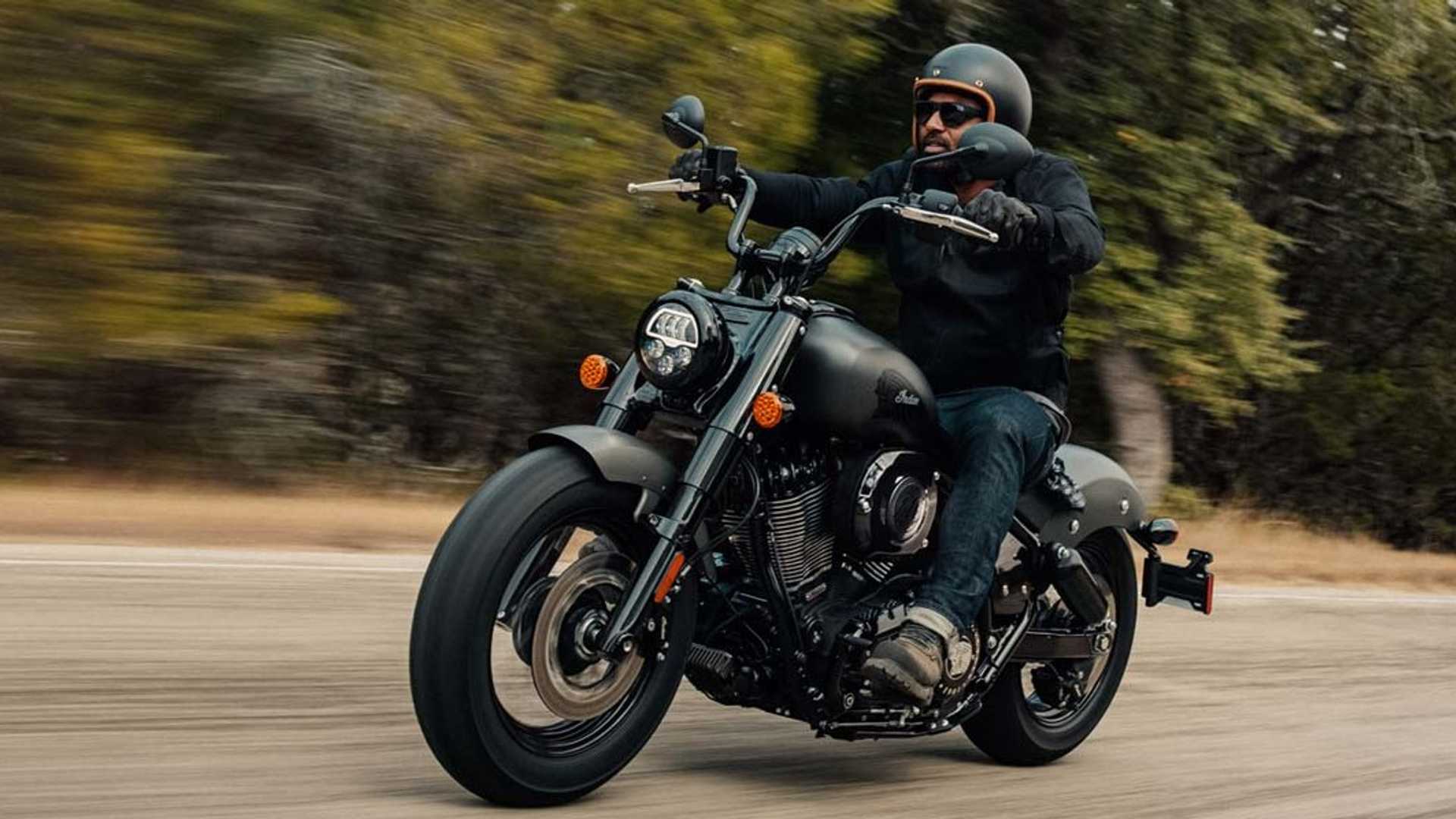 A view of the Indian Bobber, with a rider trying out the twisties on a roughly paved road