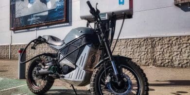A back view of the ScrAmper - an electric motorcycle from Ukranian brand EMGo, capable of using an electric car charger