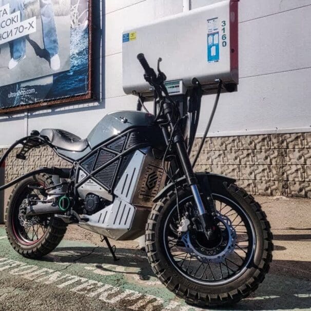 A back view of the ScrAmper - an electric motorcycle from Ukranian brand EMGo, capable of using an electric car charger