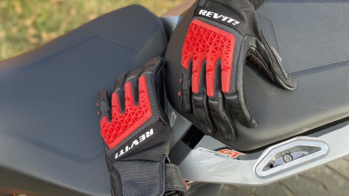 REV'IT Sand 4 Gloves in black and red lying on seat of motorcycle REV'IT Sand 4 Gloves in black and red lying on seat of motorcycle