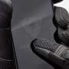 Close-up of Connect fingertip on REV'IT Sand 4 Gloves next to smartphone screen