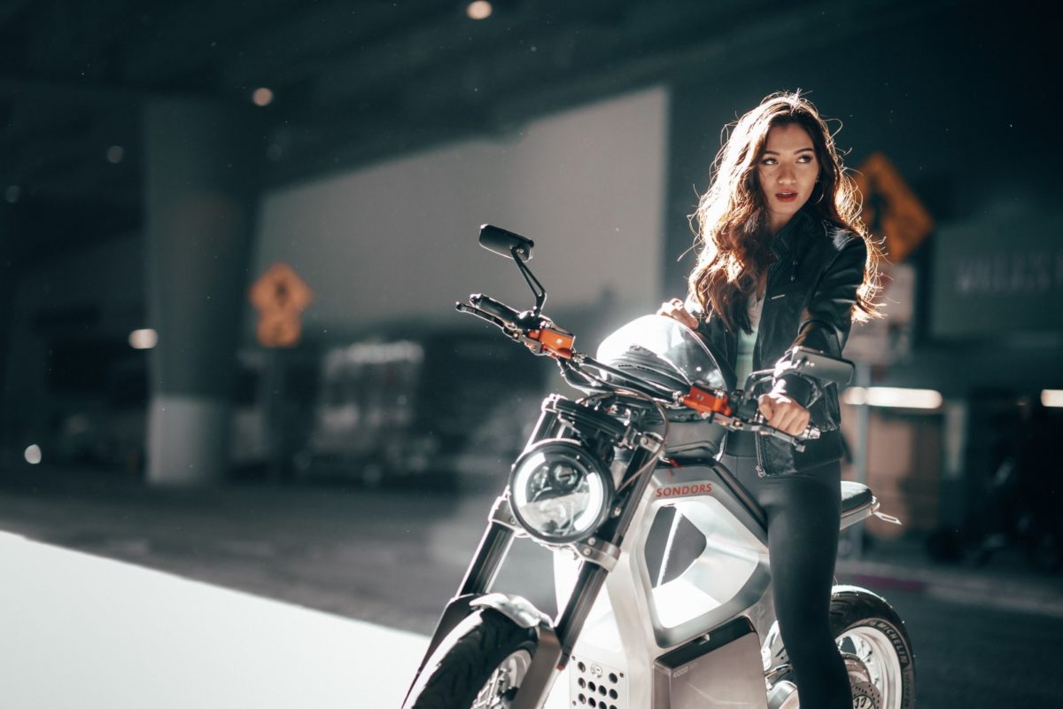 a picture of a woman on a SONDORS Metacycle