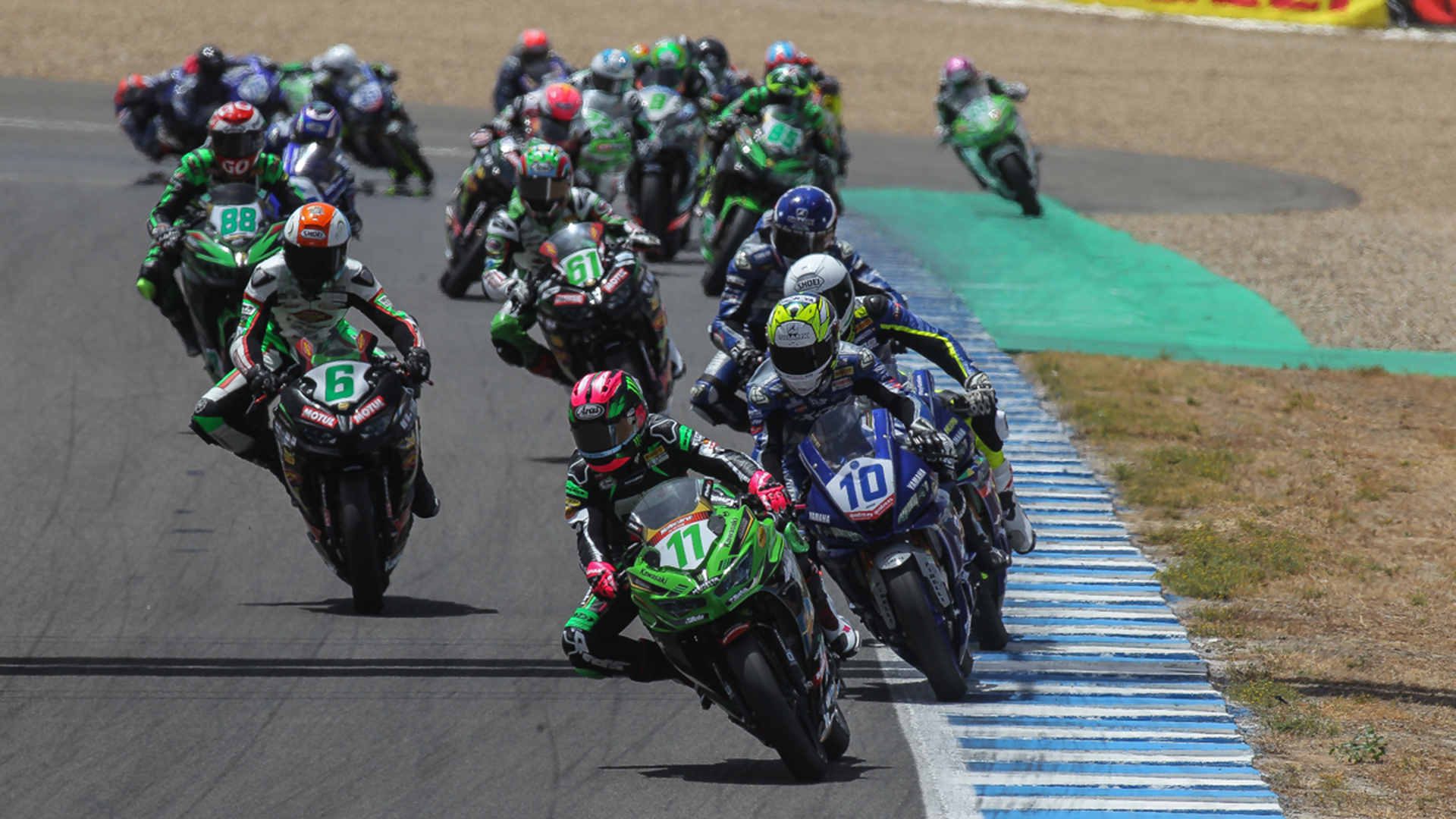 WorldSSP300: A lineup of riders leaning into the twisties