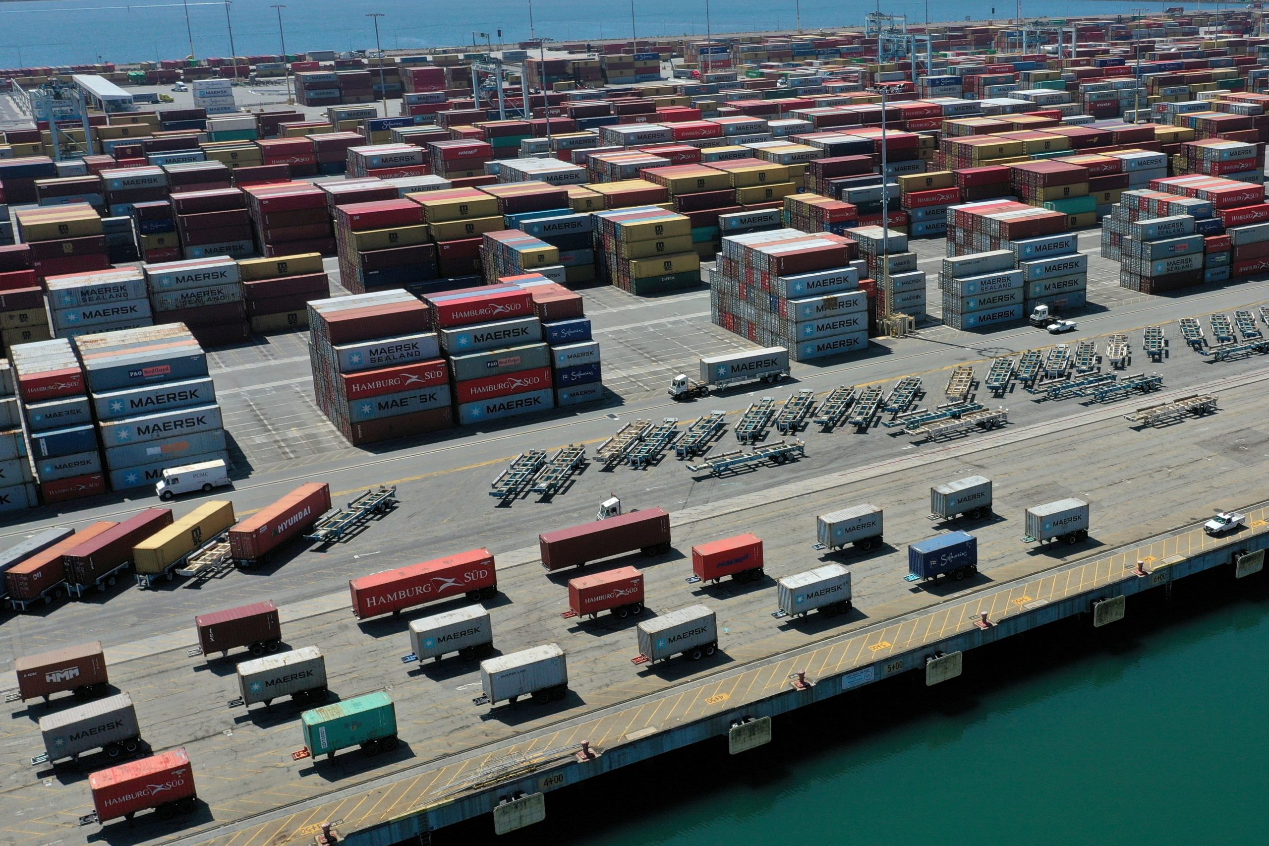 A ship carrying shipping containers full of motorcycles to happy customers. In reality, this media is a reflection of the current container inflation rates present in today's motorcycle market.