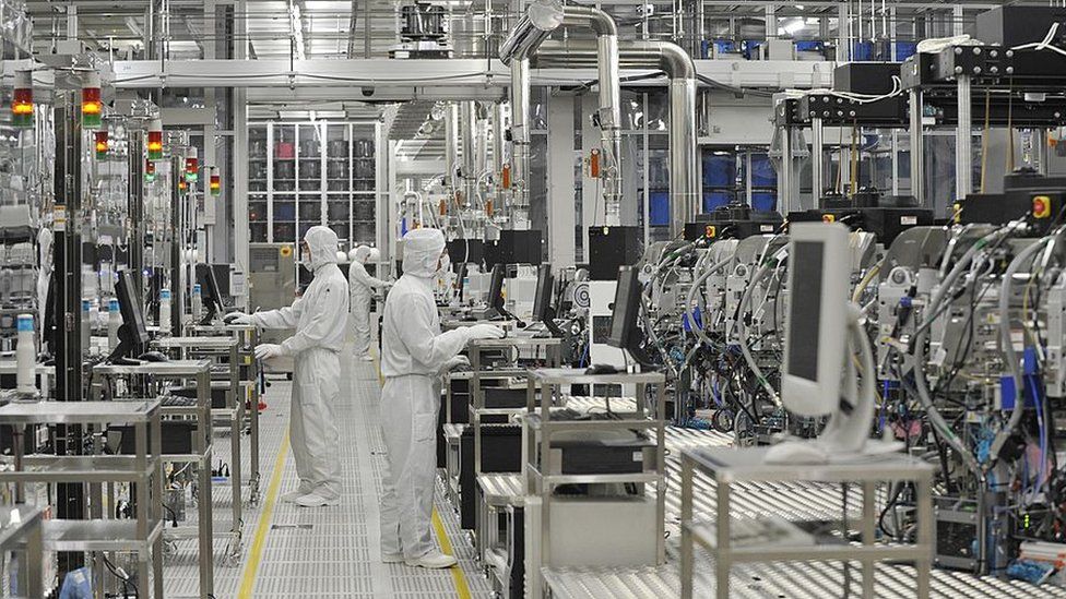 A view of workers at a semiconductor (microchip) factory