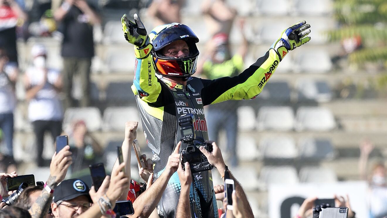Valentino Rossi enjoying his last lap of MotoGP, to the tune of 76,000 people in the crowd