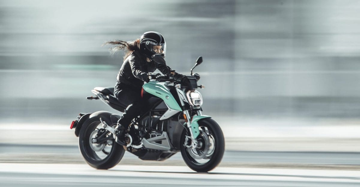 A side view of a model riding a Zero Motorcycle