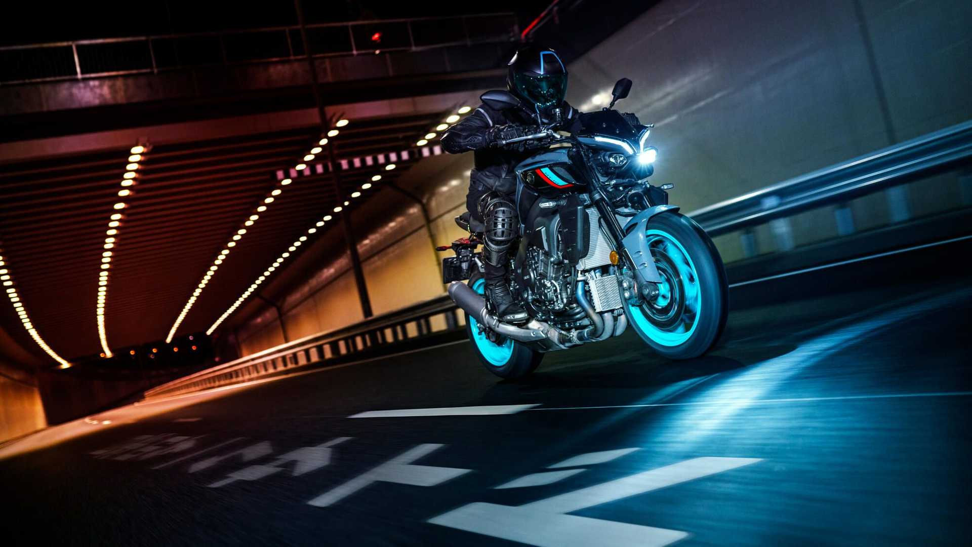 A rider on the 2022 Yamaha MT-10 riding through a tunnel at night