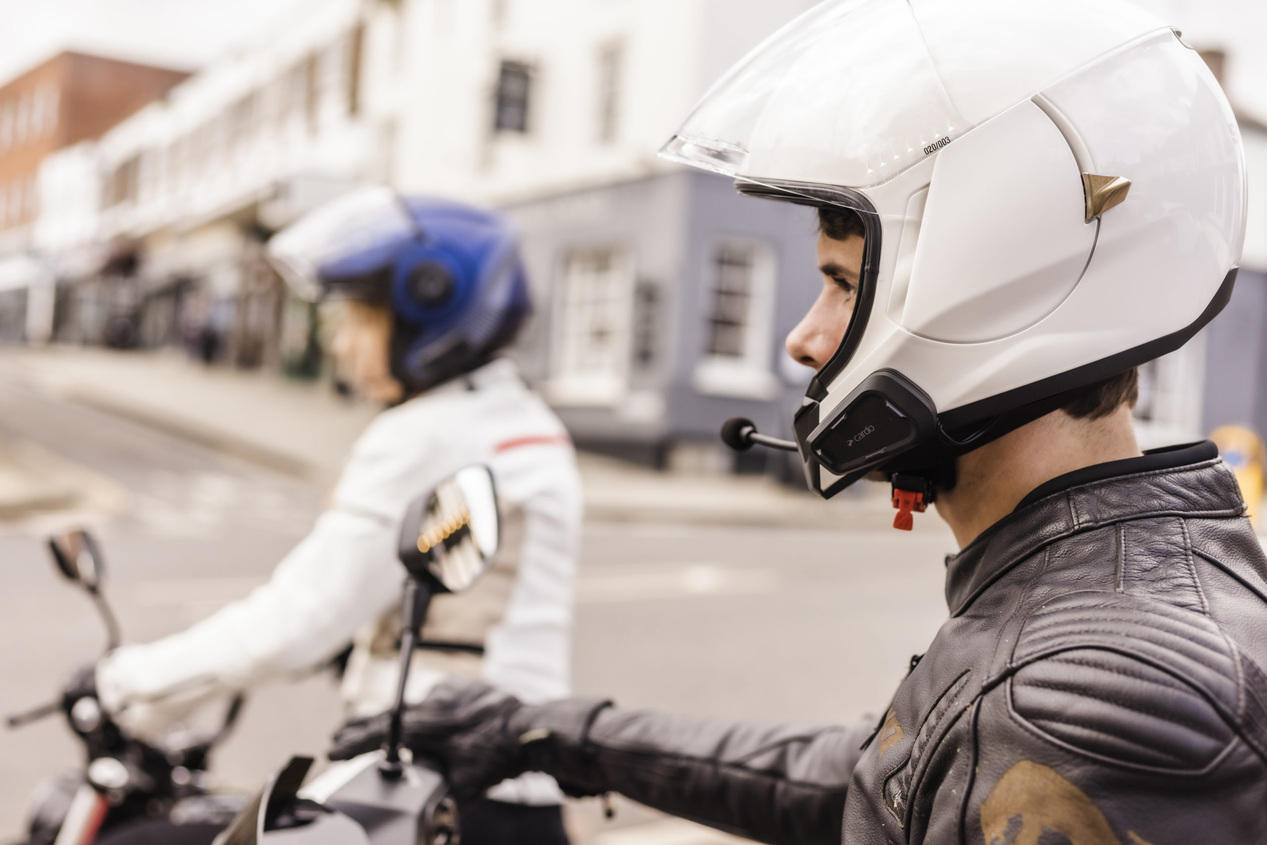 A view of two riders using the new Cardo Systems Bluetooth Communicators