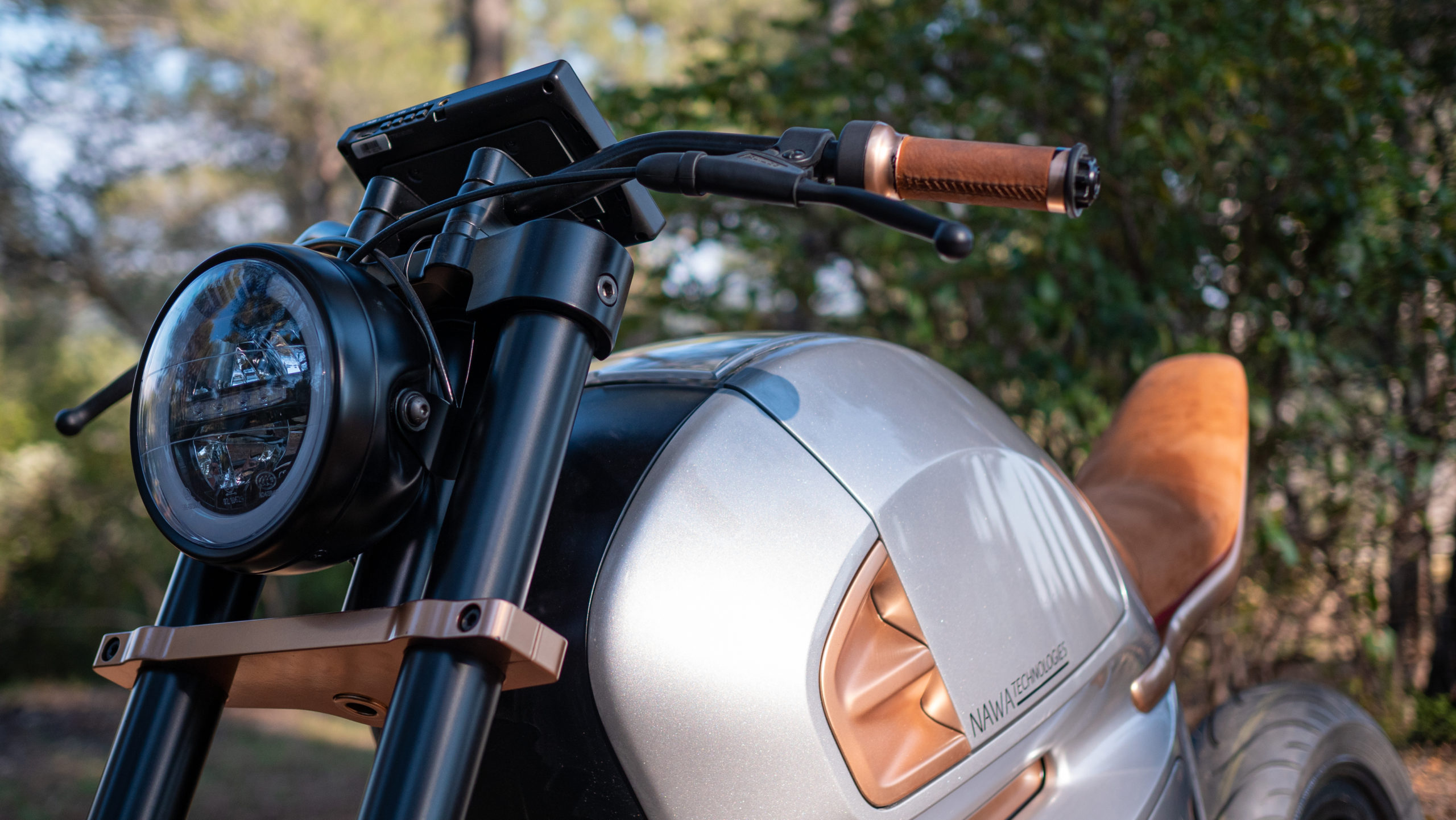 A view of the world's first hybrid electric motorcycle, available from NAWA and debuting as an electric motorbike concept for 2021 EICMA: Press release media, side front view, close-up