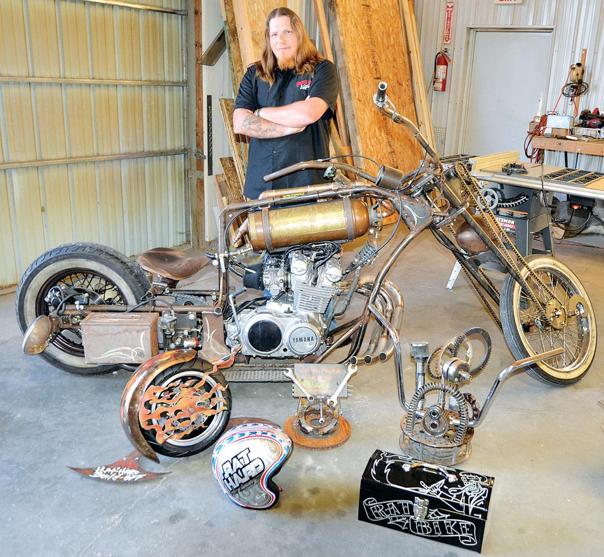 A view of a man working on a motorcycle build