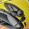 Close up of Bikecomm BK-S2 on yellow helmet lying on side