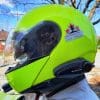 Man wearing bright yellow helmet with Bikecomm BK-S2 attached
