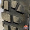 Cracks around the tread blocks of Bridgestone AX41 front tire after 8700kms