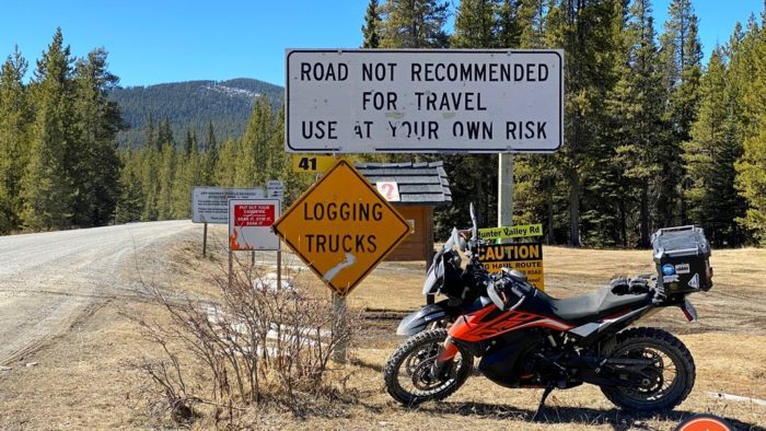 KTM 790 Adventure parked by logging road KTM 790 Adventure parked by logging road