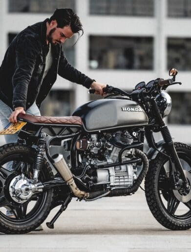 A view of a man working on a motorcycle build