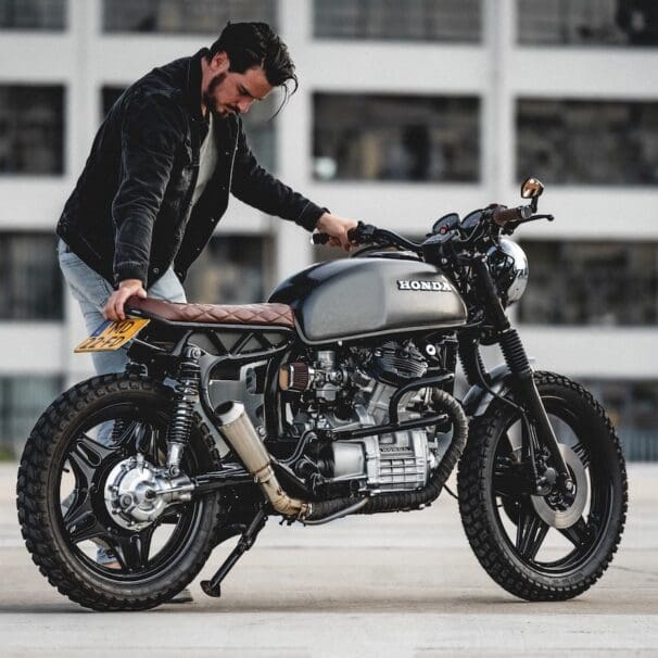 A view of a man working on a motorcycle build