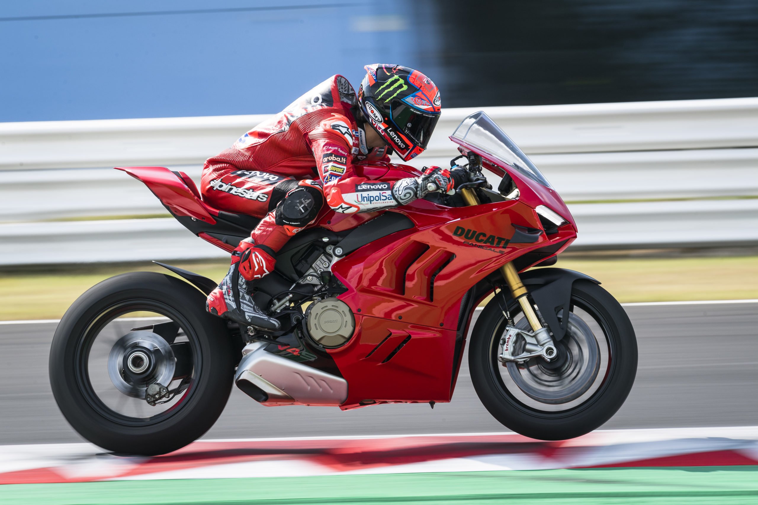 Ducati's new 2022 Panigale V4 and V4 S: A racer on a track with the Panigale with focus on the ergonomics