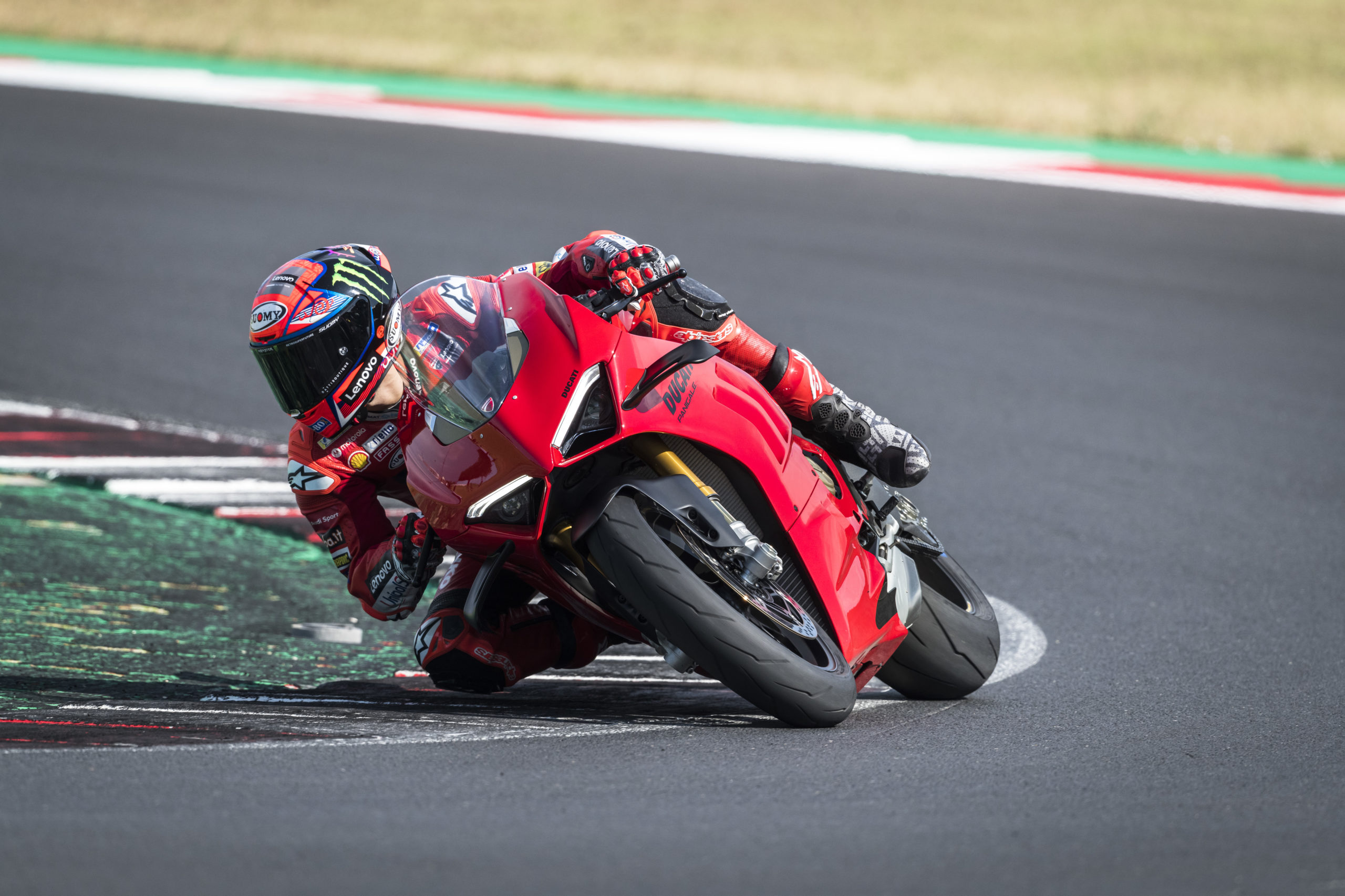 Ducati's new 2022 Panigale V4 and V4 S: A racer on a track with the Panigale with focus on the ergonomics