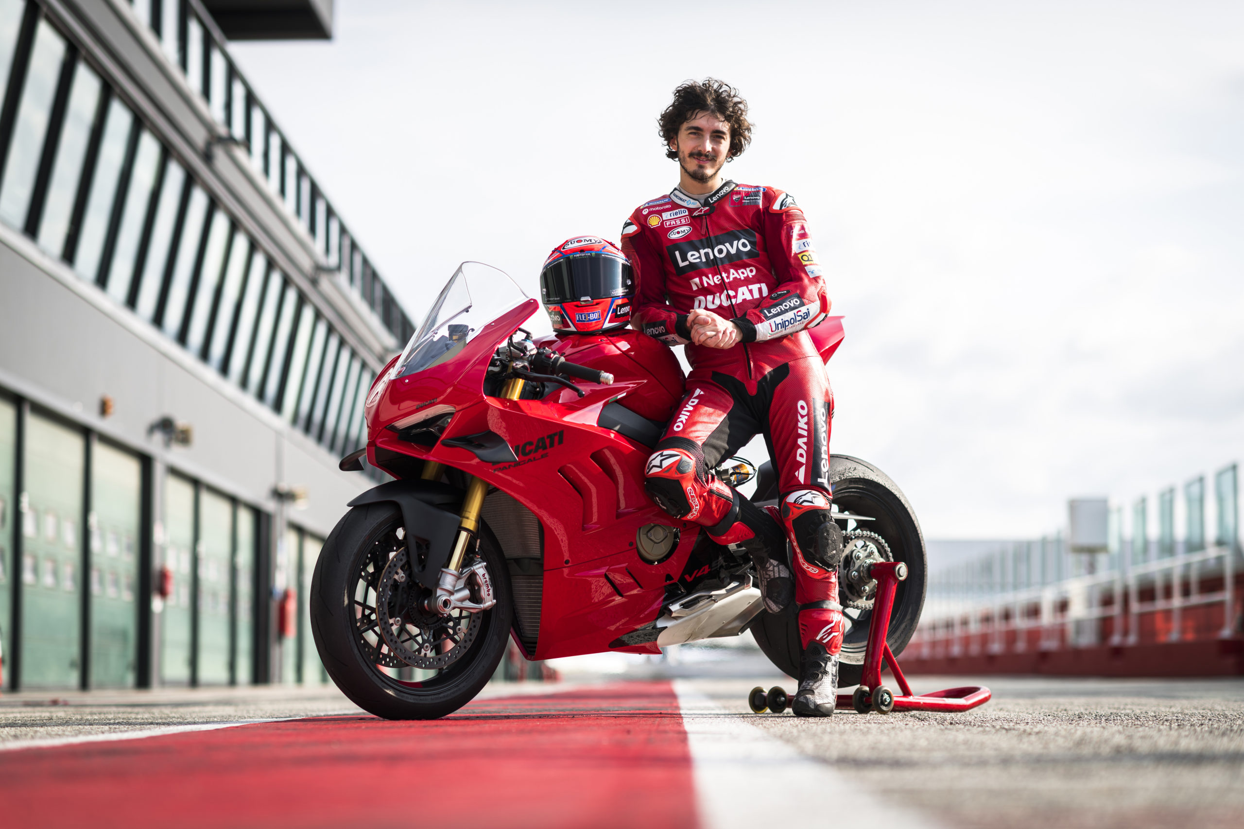 Ducati's new 2022 Panigale V4 and V4 S: race bike on the track with a rider ready to try the bike out