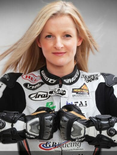 Maria Costello posing in riding gear
