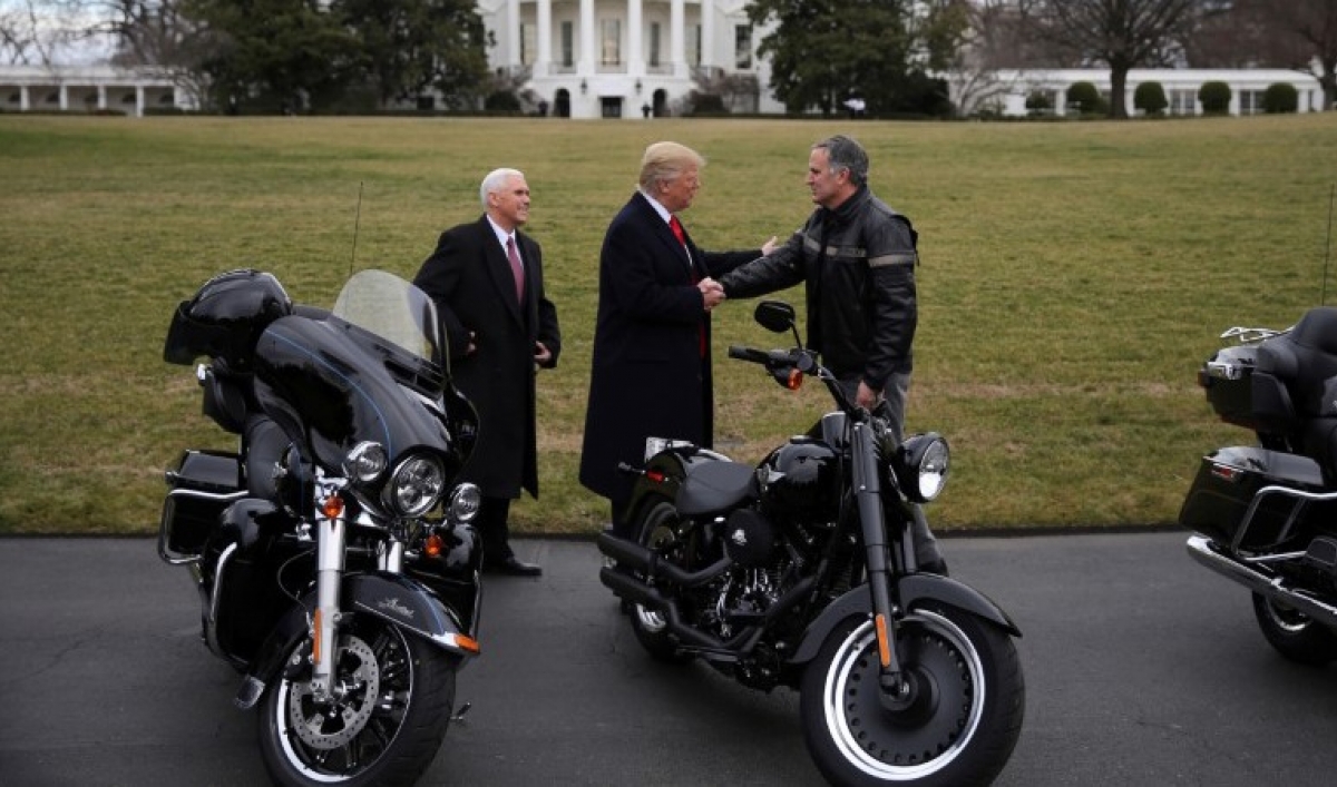 President Trump in front of the White house, admiring Harley-Davidson machines