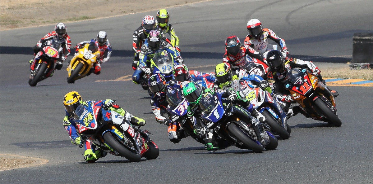 A view of racers speeding through a round of MotoAmerica