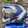 Sena SPIDER ST1 in Scorpion Exo helmet resting on blue bike