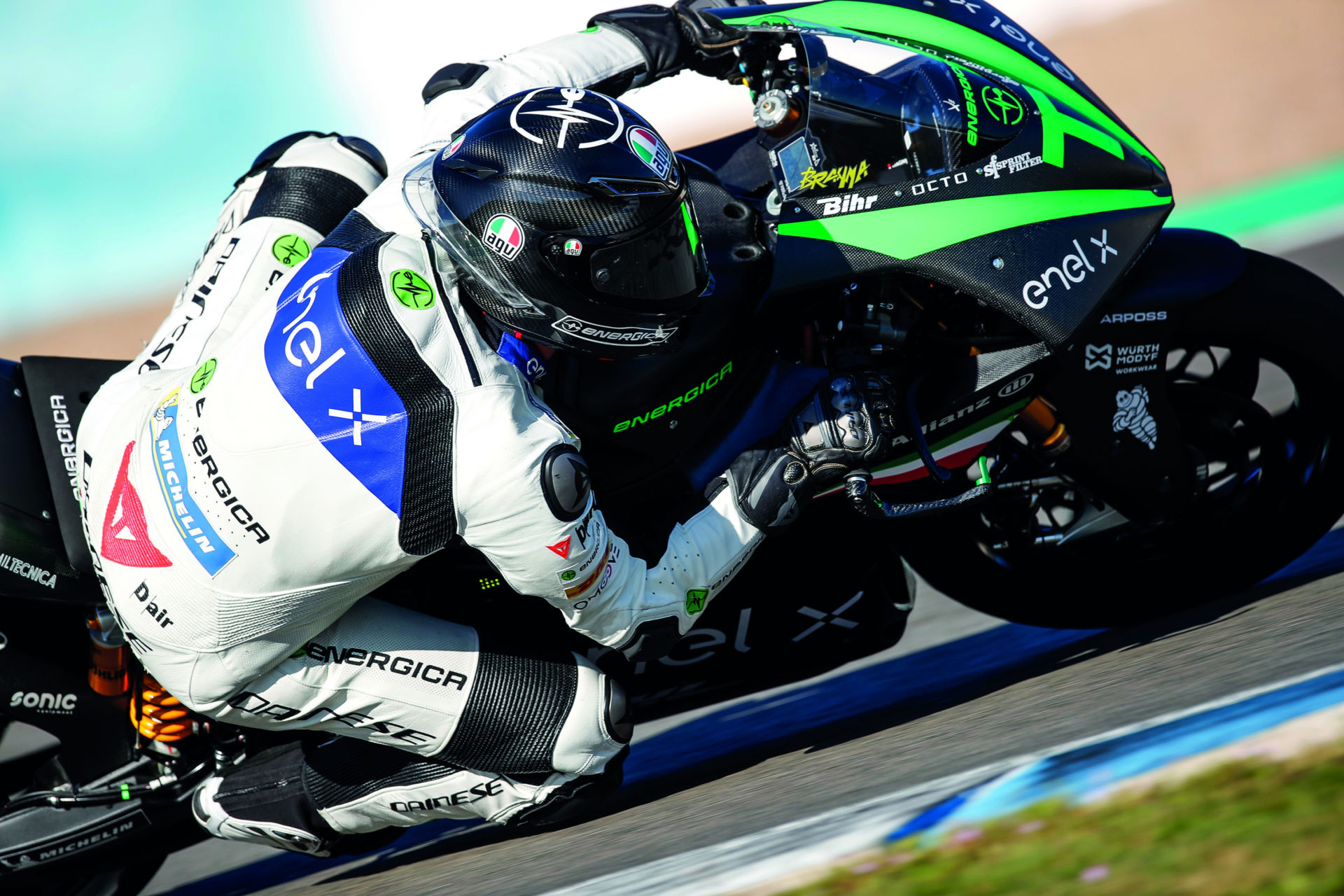 A side view of a racer with an Energica MotoE race bike