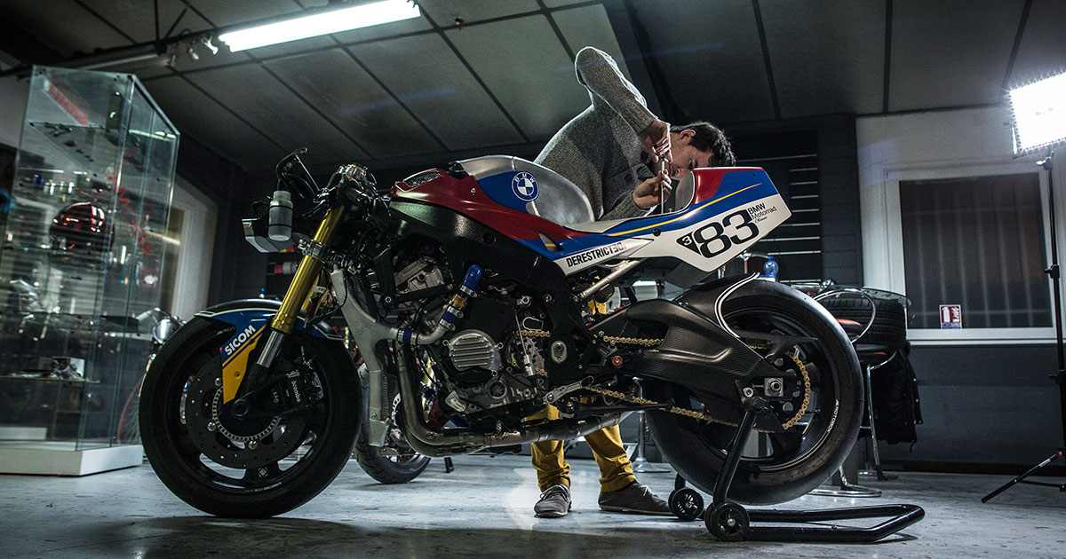 A view of a man working on a motorcycle build