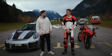 A view of Daniel Abt and a motorcyclist trying out a quarter-mile drag race between a Ducati Panigale V4 S and a Porsche GT2 RS