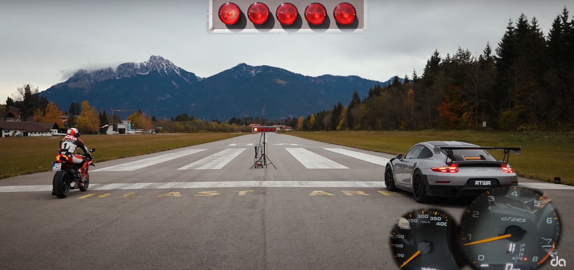 a quarter-mile drag race between a Ducati Panigale V4 S and a Porsche GT2 RS