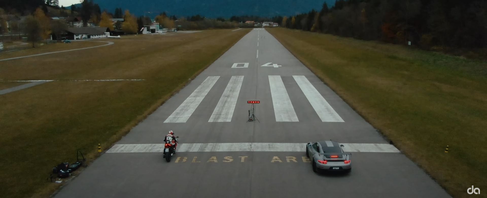 a quarter-mile drag race between a Ducati Panigale V4 S and a Porsche GT2 RS