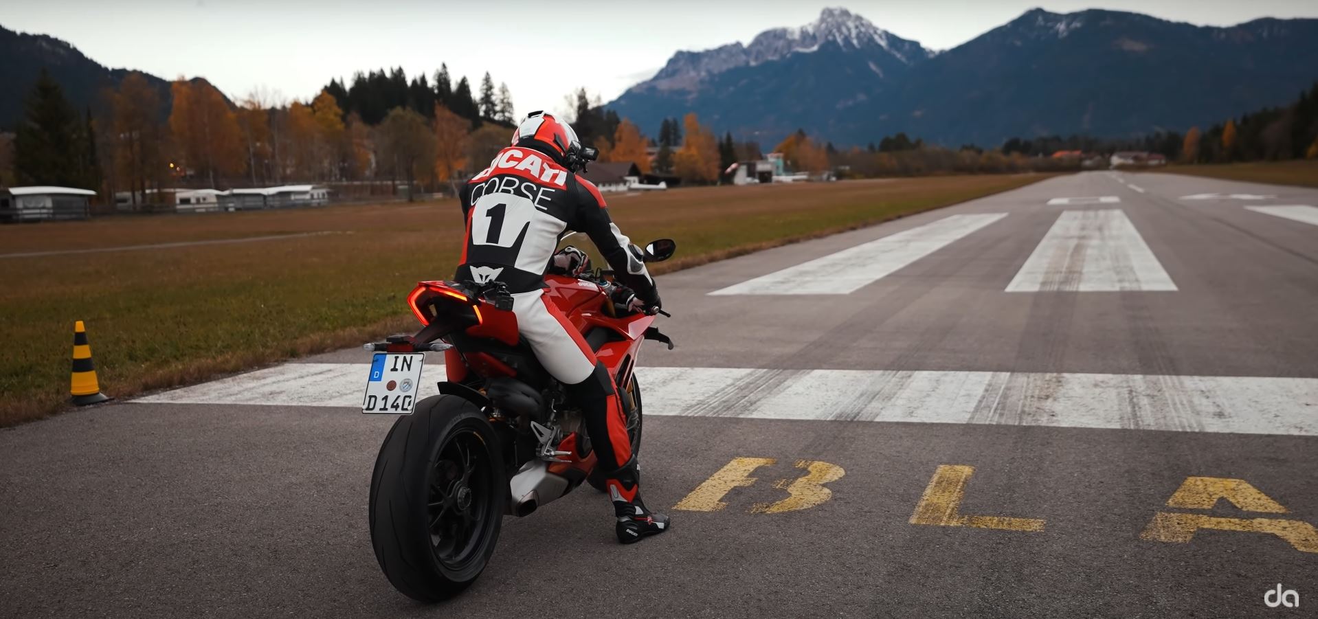 a quarter-mile drag race between a Ducati Panigale V4 S and a Porsche GT2 RS