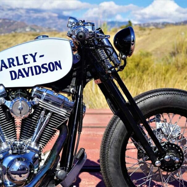 the front-side view from the custom "Springer Bobber Blue" Harley-Davidson Softail Standard Motorcycle from Lord Drake Kustoms