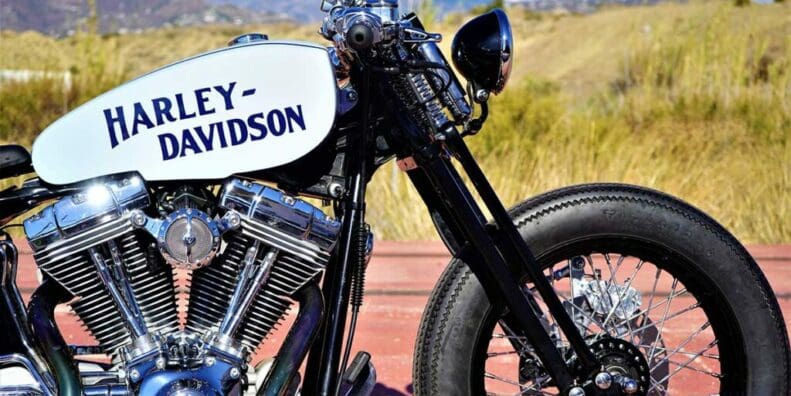 the front-side view from the custom "Springer Bobber Blue" Harley-Davidson Softail Standard Motorcycle from Lord Drake Kustoms