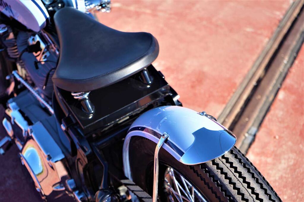 the seat view from the custom "Springer Bobber Blue" Harley-Davidson Softail Standard Motorcycle from Lord Drake Kustoms