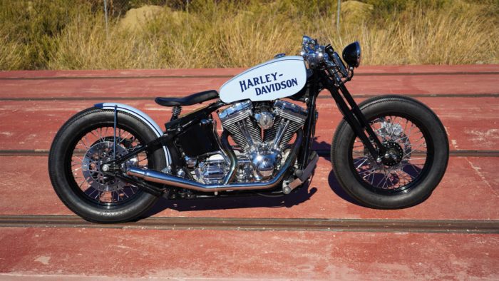 A side view from the custom Springer Bobber Blue Harley-Davidson Softail Standard Motorcycle from Lord Drake Kustoms