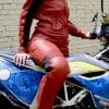 A view of Kathleen Eberle on her motorcycle, featuring the Raven Rova Phoenix jacket and pants.