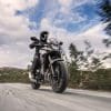 2021-Honda-CB500X with rider taking the bike through forest-like topography