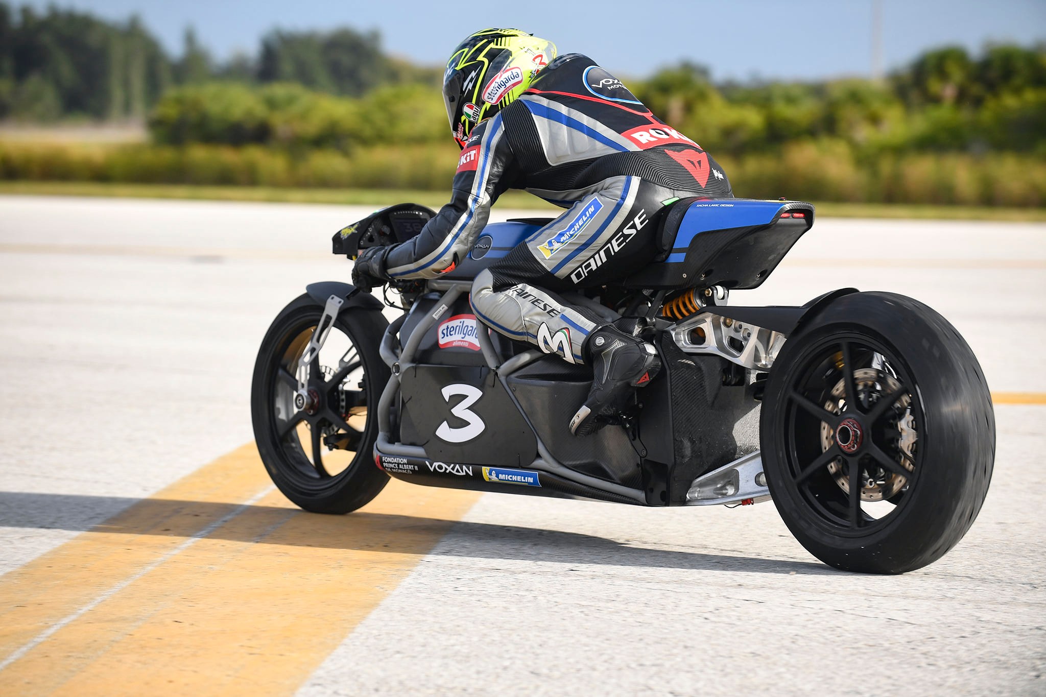 A view of the Voxan team working at and successfully blasting through 21 electric motorcycle speed records on Space Florida’s Launch and Landing Facility