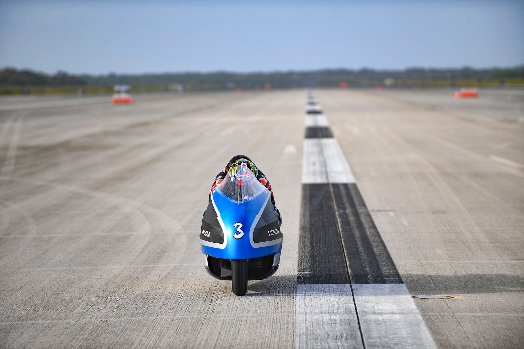 A view of the Voxan team working at and successfully blasting through 21 electric motorcycle speed records on Space Florida’s Launch and Landing Facility