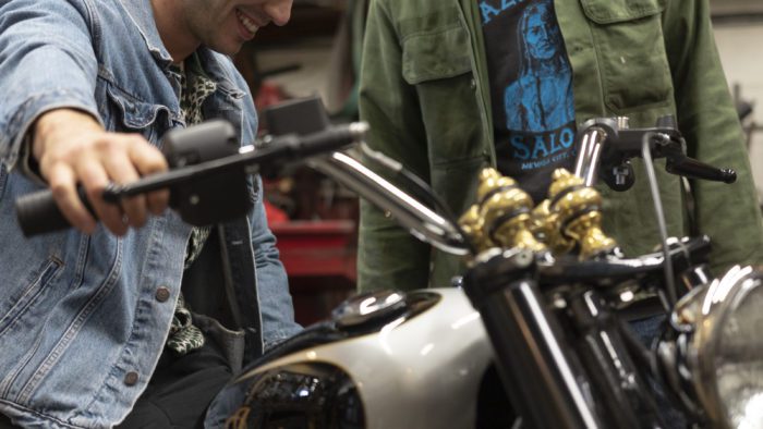 Gō Takamine with Nicolas Hoult next to the new Brat Style bobber from Inaidn Motorcycles that Takamine modded out for the movie star